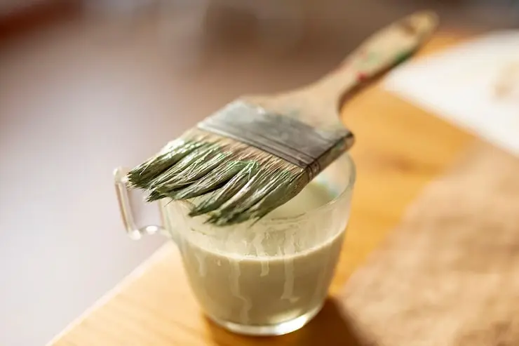 How to clean oil paint brushes using solvent, soap, and warm water