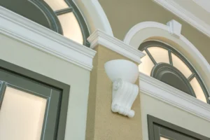 What is Crown Moulding example on exterior arched window trim with decorative molding detail