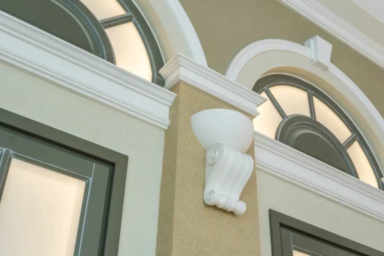 What is Crown Moulding example on exterior arched window trim with decorative molding detail